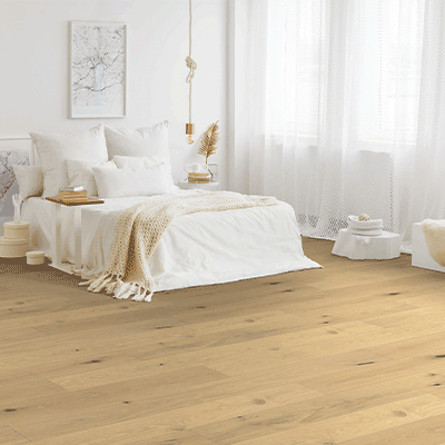hardwood flooring in bedroom with sheer curtains